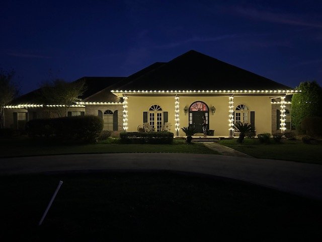 Columned home with warm white lighting