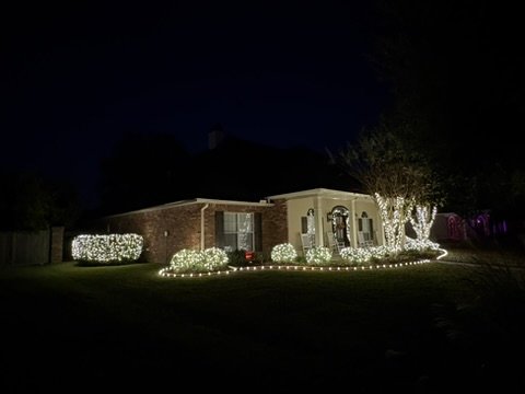 Ranch home with garage and roofline lighting